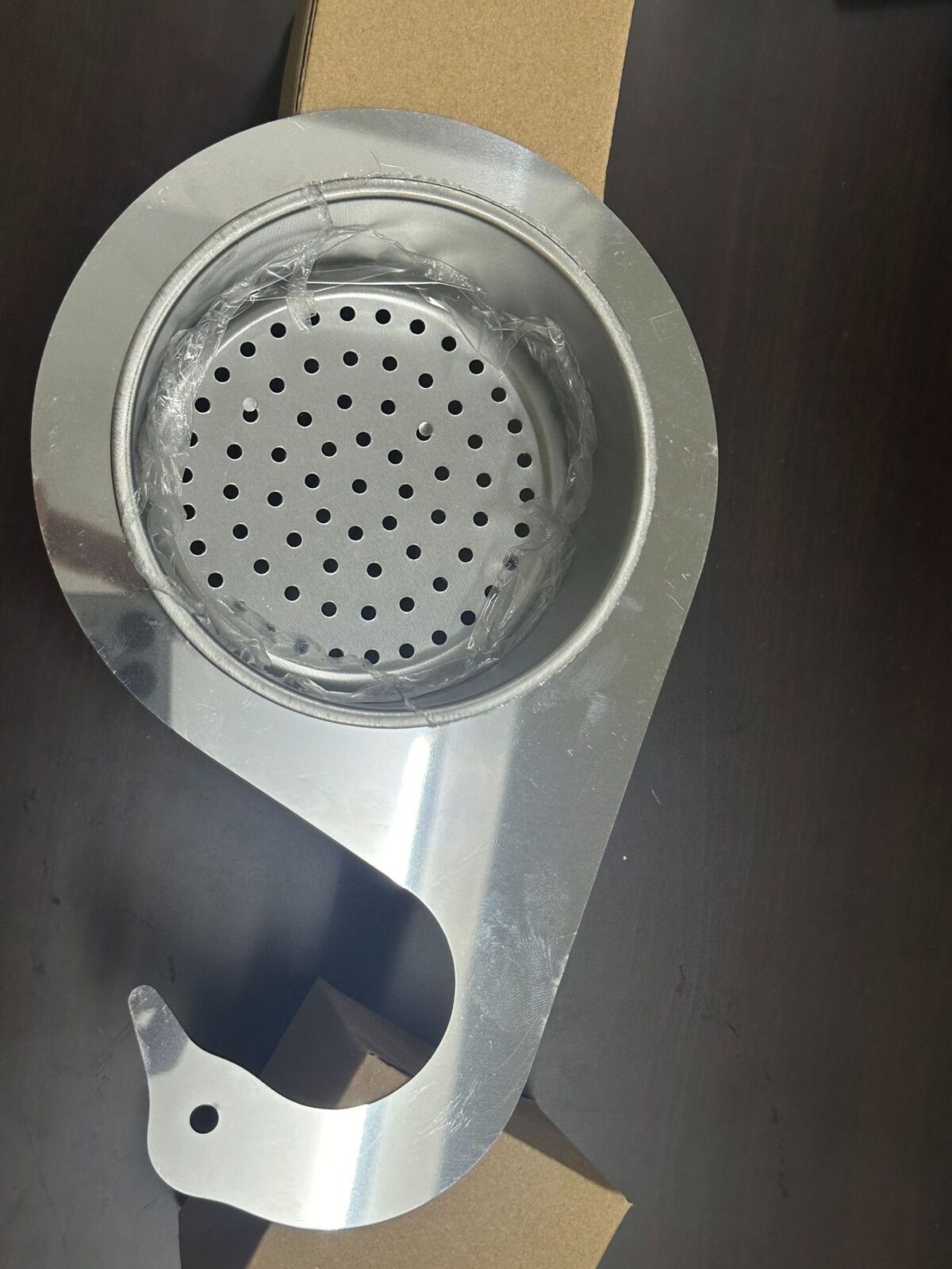 High-quality stainless steel kitchen sink strainer with swan design for filtering food waste.